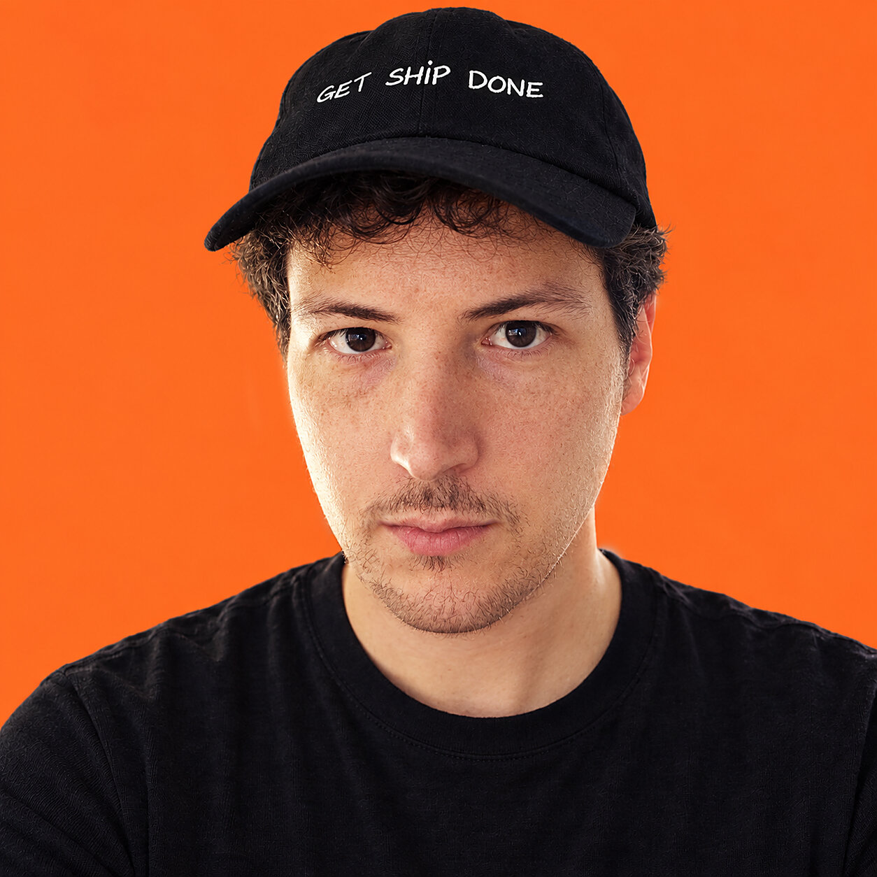 Matteo Gazzoni, wearing a black cap that says get ship done